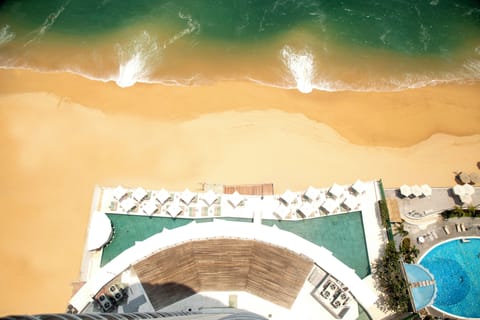 On the beach, sun loungers, beach umbrellas, beach towels