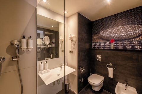 Shower, designer toiletries, hair dryer, bidet