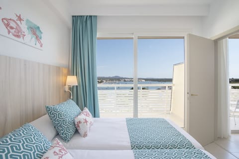 Junior Suite, Partial Sea View | In-room safe, desk, free WiFi, bed sheets