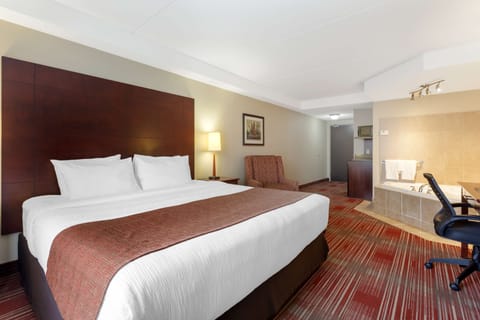 Suite, 1 King Bed, Non Smoking, Jetted Tub | Iron/ironing board, free WiFi, bed sheets