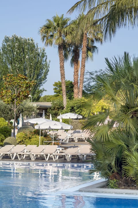 Indoor pool, outdoor pool, pool umbrellas, sun loungers