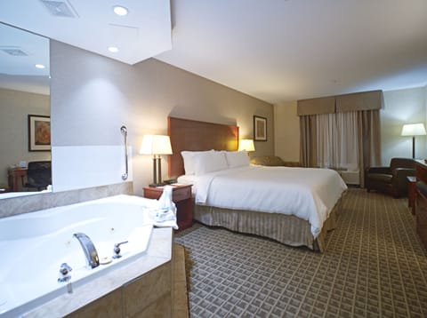 Suite, 1 King Bed, Jetted Tub | In-room safe, desk, iron/ironing board, free cribs/infant beds