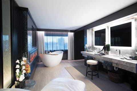 Suite, 1 King Bed | Bathroom | Shower, free toiletries, hair dryer, towels