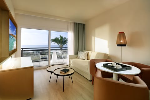 Junior Suite, Sea View | Living area | 42-inch flat-screen TV with satellite channels, TV, iPod dock