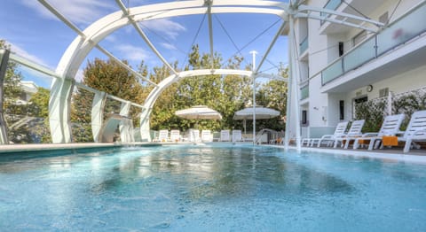 Outdoor pool, pool umbrellas, sun loungers