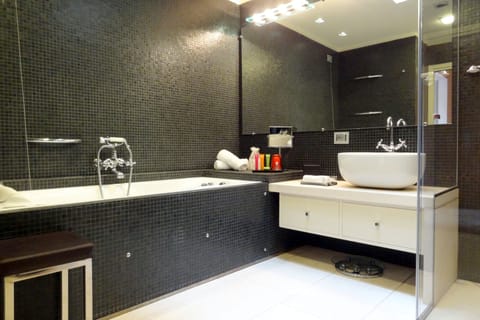 Suite, Partial Lake View (Prestige) | Bathroom | Hair dryer, slippers, bidet, towels