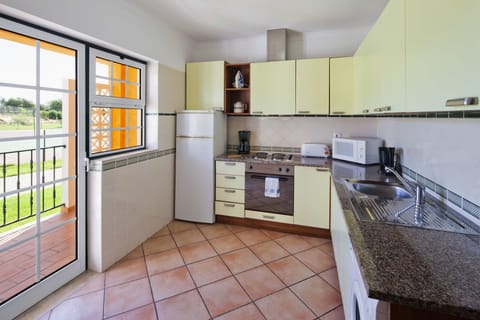 Apartment, 1 Bedroom | Private kitchen | Fridge, microwave, stovetop, coffee/tea maker