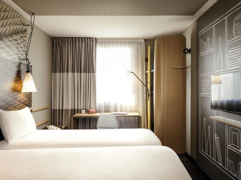 Premium bedding, desk, laptop workspace, blackout drapes