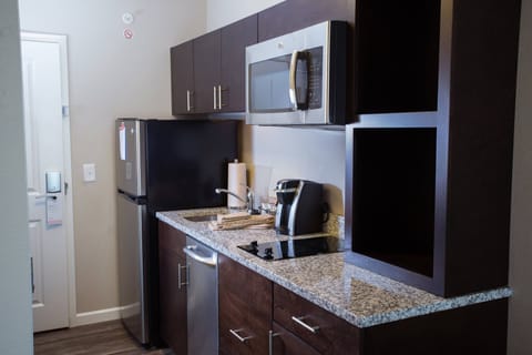 Studio, 2 Queen Beds | Private kitchen | Full-size fridge, microwave, stovetop, dishwasher