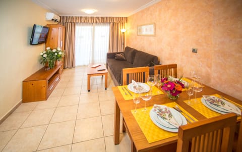 Apartment, 1 Bedroom | Living room | 30-inch flat-screen TV with satellite channels, TV