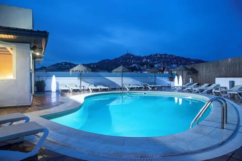 Outdoor pool, a rooftop pool, sun loungers