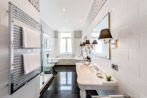 Separate tub and shower, rainfall showerhead, designer toiletries