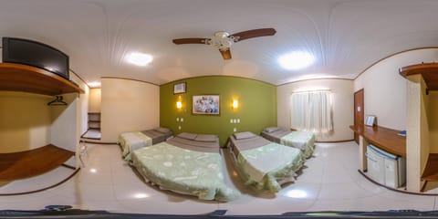 Family Room | Minibar, blackout drapes, free WiFi, bed sheets