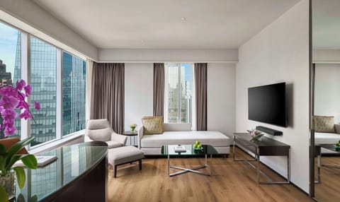 Suite, 1 King Bed, City View | Living room | 55-inch Smart TV with satellite channels