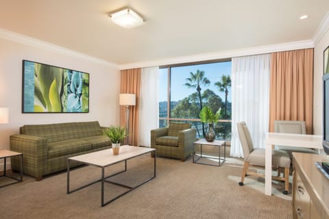 Suite, 1 Bedroom, Bay View | Living area | 37-inch flat-screen TV with cable channels, TV