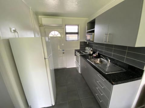 Two Bedroom Apartment | Private kitchen | Fridge, microwave, oven, stovetop