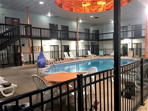 Indoor pool, open 8 AM to 10 PM, pool umbrellas