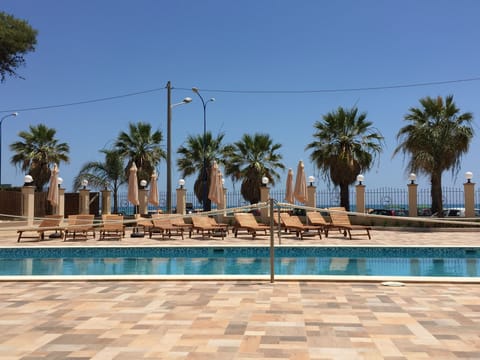 Outdoor pool, open 9 AM to 7 PM, pool umbrellas, sun loungers