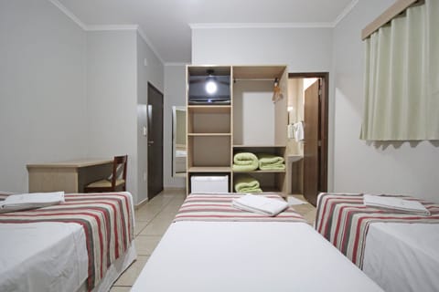 Deluxe Quadruple Room | Minibar, blackout drapes, free WiFi, bed sheets