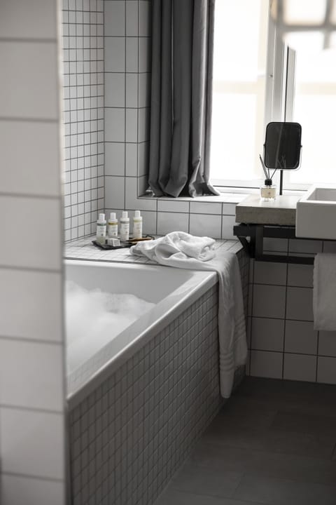 Suite | Bathroom | Shower, designer toiletries, hair dryer, towels