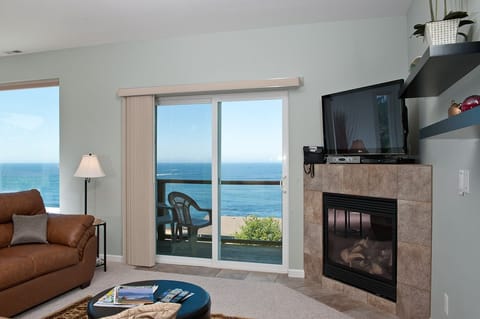 Top Floor Condo, 2 Bedrooms, Kitchen, Ocean View (Snuggle Up) | Living area | Flat-screen TV, fireplace, DVD player