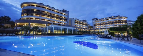 Indoor pool, seasonal outdoor pool, pool umbrellas, sun loungers