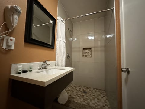 Basic Room, 2 Queen Beds, Non Smoking | Bathroom | Shower, hair dryer, towels