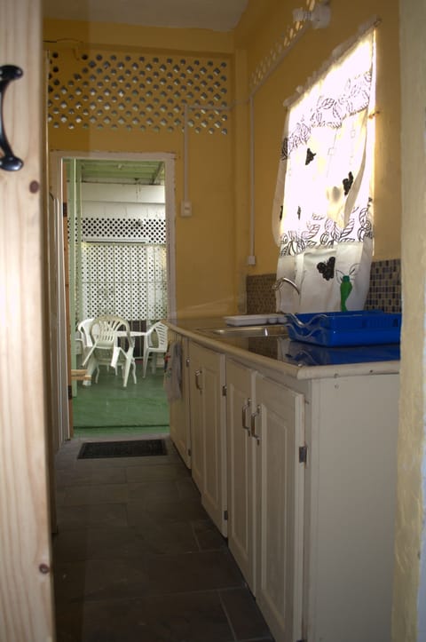 Tobago Apartment | Private kitchen | Fridge, microwave, stovetop