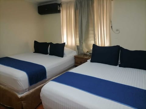 Standard Double Room, 2 Queen Beds | Iron/ironing board, rollaway beds, free WiFi, bed sheets