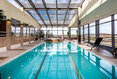 Indoor pool, open 7:00 AM to 10:00 PM, sun loungers