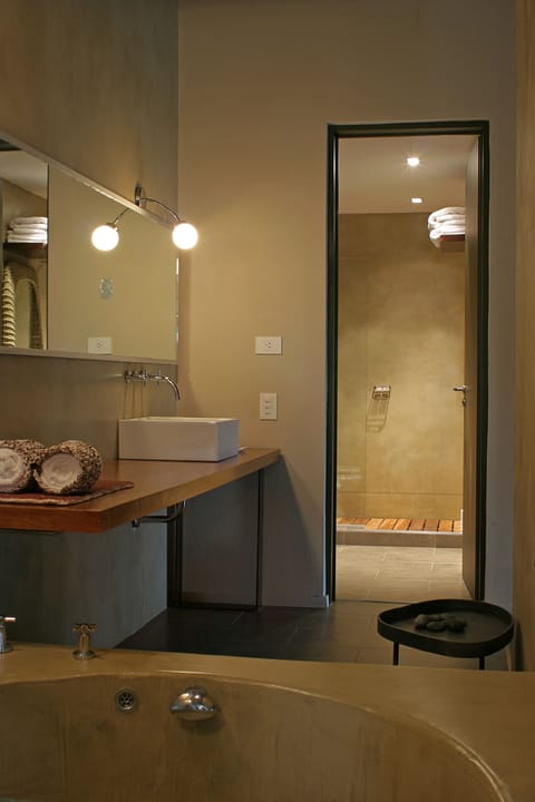 Suite, 1 Queen Bed | Bathroom | Combined shower/tub, hair dryer, bidet, towels