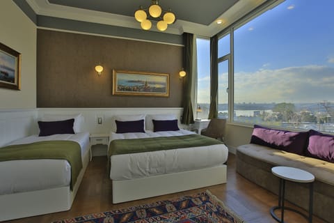 Deluxe Quadruple Room, Sea View | In-room safe, desk, soundproofing, free WiFi