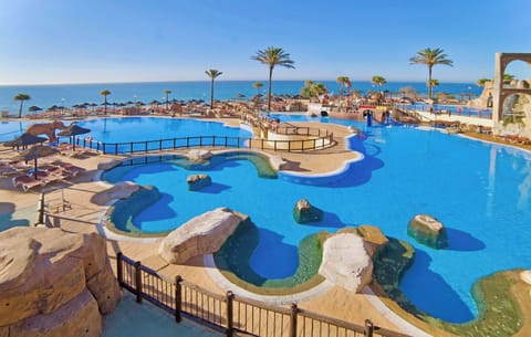 Indoor pool, outdoor pool, pool umbrellas, sun loungers
