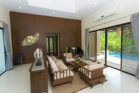 Deluxe Pool Villa | Living room | 32-inch LCD TV with satellite channels, TV