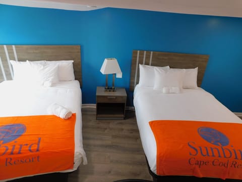 Club Quadruple Room, 2 Queen Beds | Individually furnished, desk, laptop workspace, soundproofing