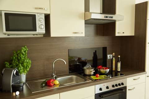 Apartment, 2 Bedrooms, Balcony | Private kitchen | Fridge, microwave, stovetop, coffee/tea maker