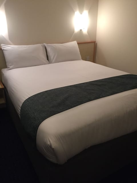 Premium bedding, desk, laptop workspace, free WiFi