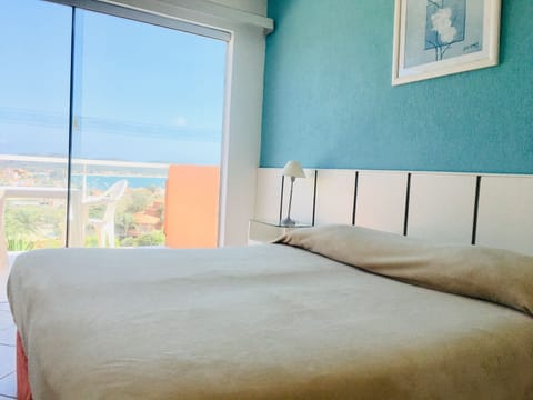 Twin Room, Ocean View | Minibar, in-room safe, individually furnished, blackout drapes