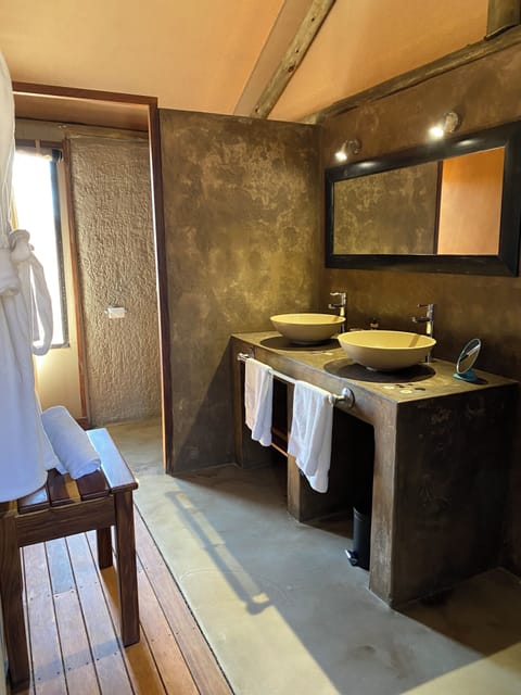 Tented Chalet | Bathroom | Shower, hair dryer, bathrobes, slippers