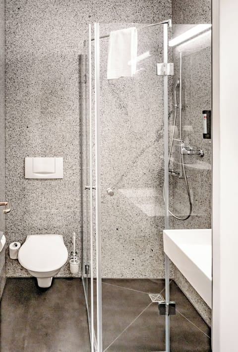 Shower, eco-friendly toiletries, hair dryer, towels