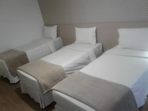 Standard Quadruple Room | Minibar, in-room safe, blackout drapes, free WiFi