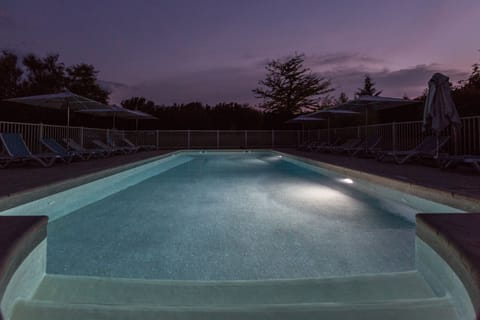 Seasonal outdoor pool, open 7:00 AM to 10:00 PM, pool umbrellas