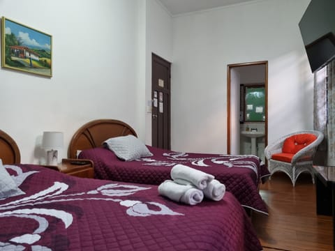 Family Quadruple Room, 2 Double Beds | In-room safe, iron/ironing board, free WiFi, bed sheets