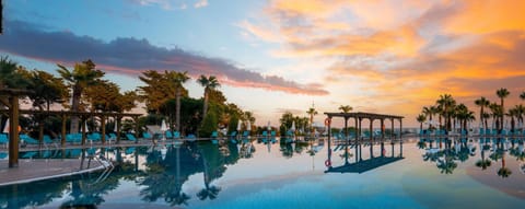 Indoor pool, outdoor pool, pool umbrellas, sun loungers