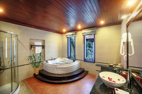 Family Suite, River View | Bathroom | Combined shower/tub, rainfall showerhead, designer toiletries