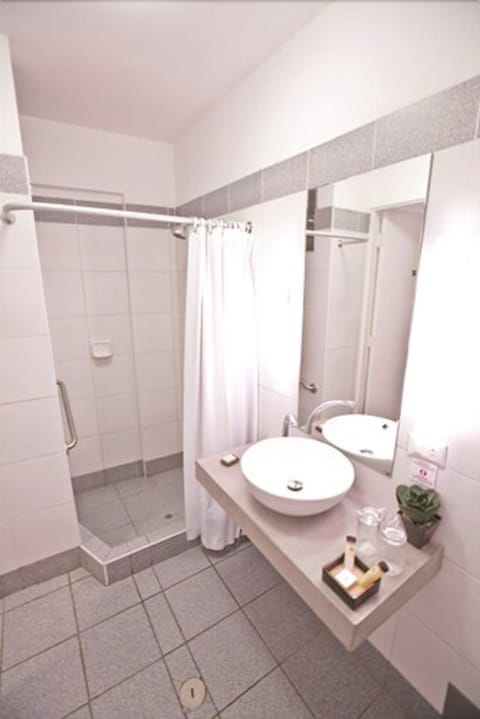 Standard Double Room, 1 King Bed | Bathroom | Shower, free toiletries, hair dryer, towels