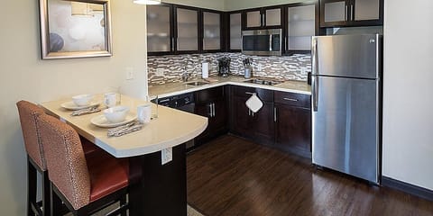 Studio Suite, Kitchen | Private kitchen | Full-size fridge, microwave, stovetop, dishwasher