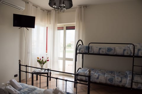 Quadruple Room, Multiple Beds, Private Bathroom | Hypo-allergenic bedding, free WiFi, bed sheets