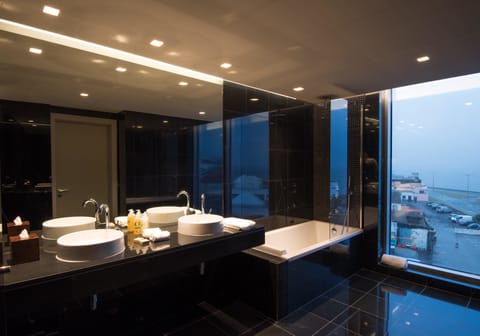 Suite, Sea View | Bathroom | Combined shower/tub, rainfall showerhead, free toiletries, hair dryer