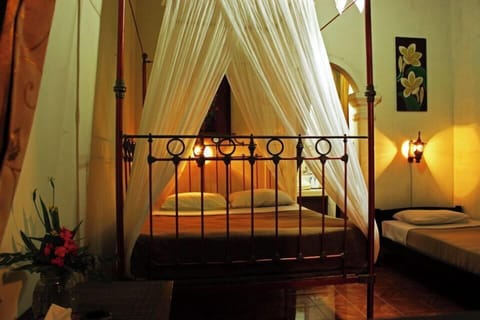 Colonial Style House | Desk, bed sheets